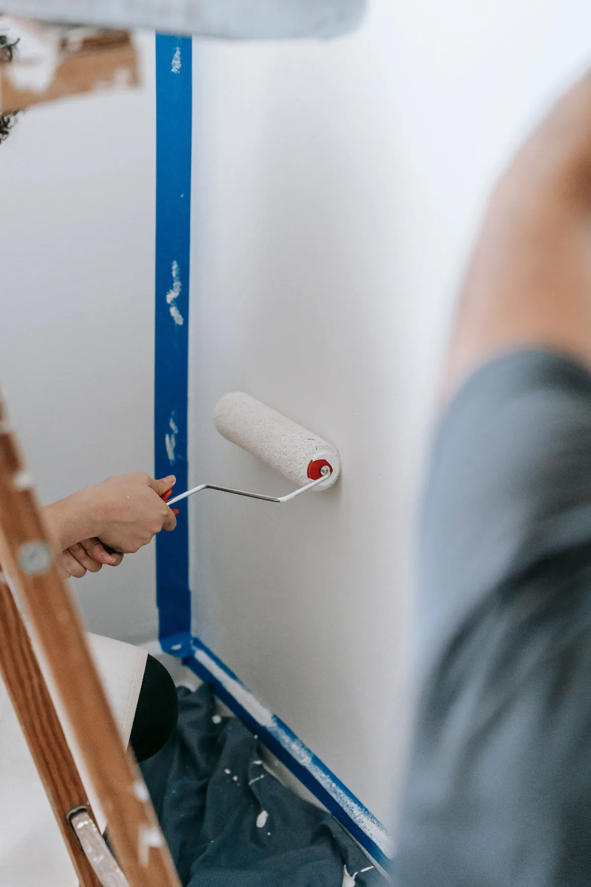 Stock photo of a wall being painted with a roller